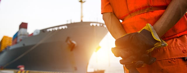 person standing in front of ship